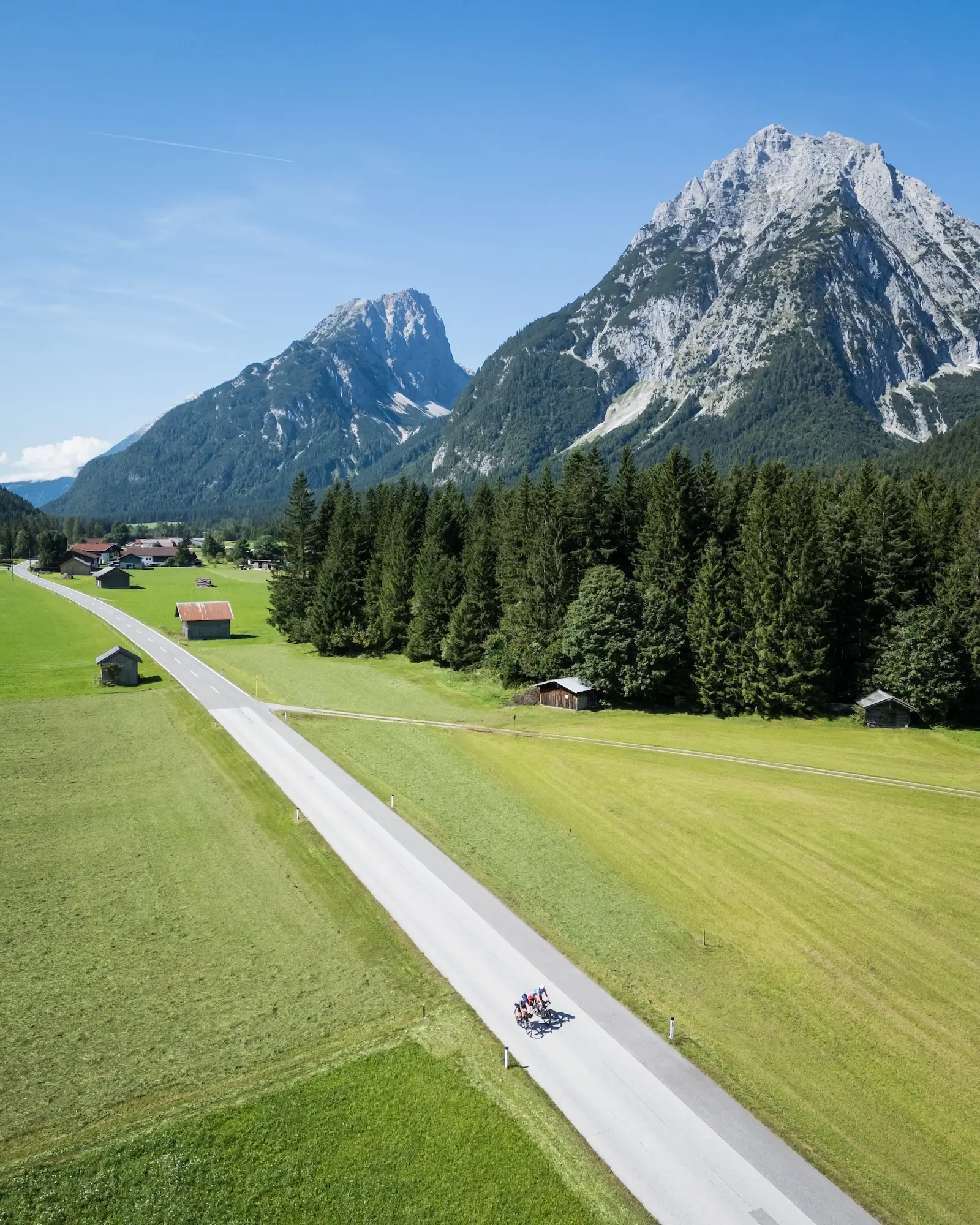 Alpine landscape, cycle path beside an alpine lake, morning mist